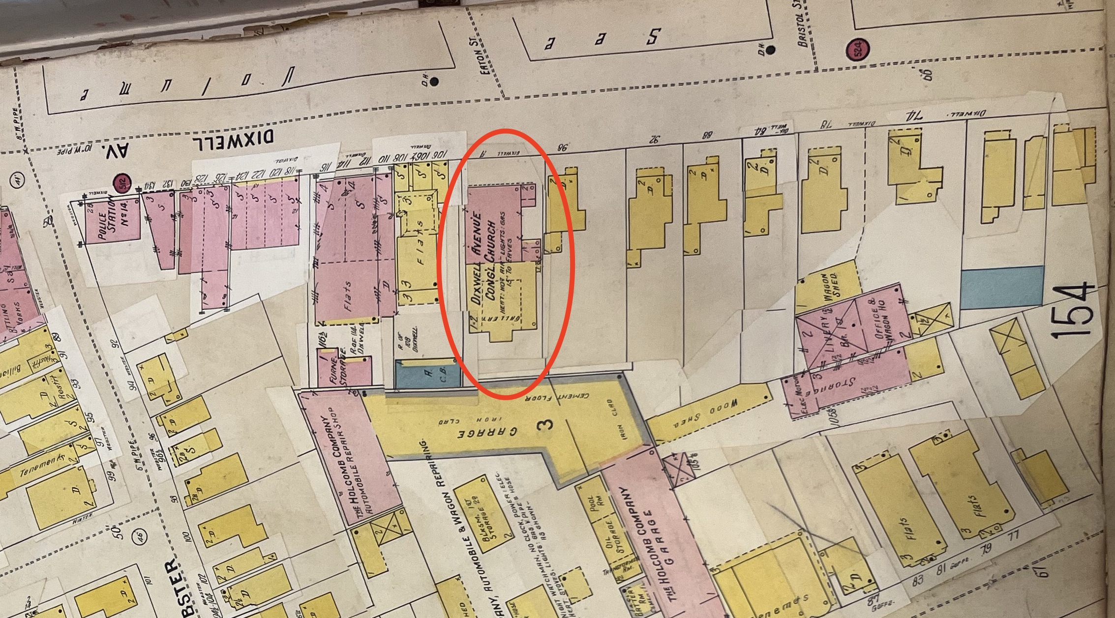 Dixwell Avenue in 1923. The precursor to the United House of Prayer, the Dixwell Ave Congregational Church, was present at 100 Dixwell. Note the mixed materials indicated by the color-coding: the front of the building was brick indicated in pink, while the back was wood frame indicated in yellow.