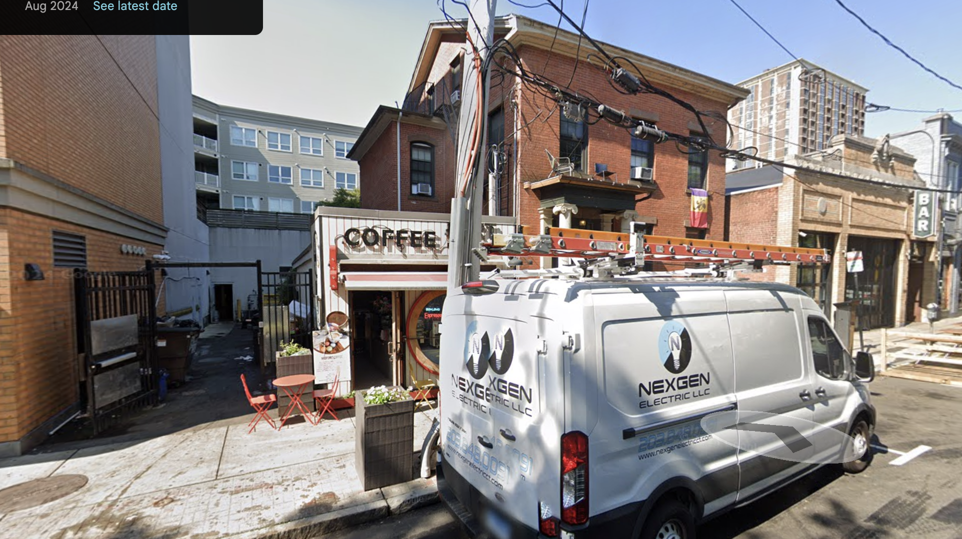The August 2024 view shows Midpoint Coffee Brewers occupying the small storefront beside 250 Crown. The image captures the present mixed-use character of the parcel: a nineteenth-century residence immediately adjacent to a small street-facing business.