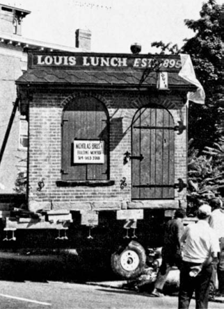 This image shows the moving process of moving the building by Nicholas Bros.