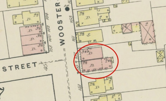 157, 155, and 153 Wooster shown on the Sanborn map as two single-family dwellings, constructed out of brick. 